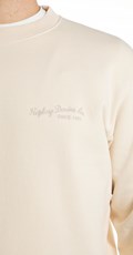 BEŽ SWEATSHIRT S MINI NATPISOM NA PRSIMA - 4